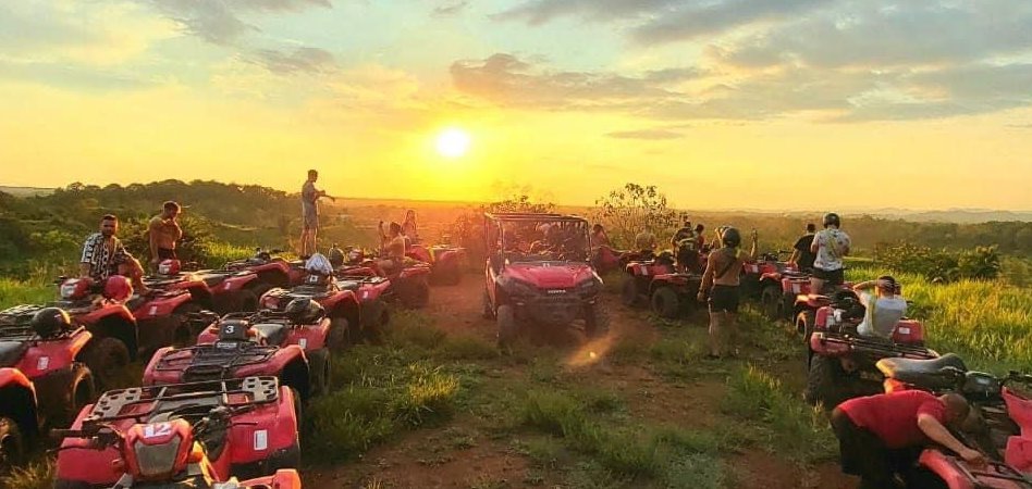 FourTrax ATVs and guests overlooking rural Costa Rica at sunset