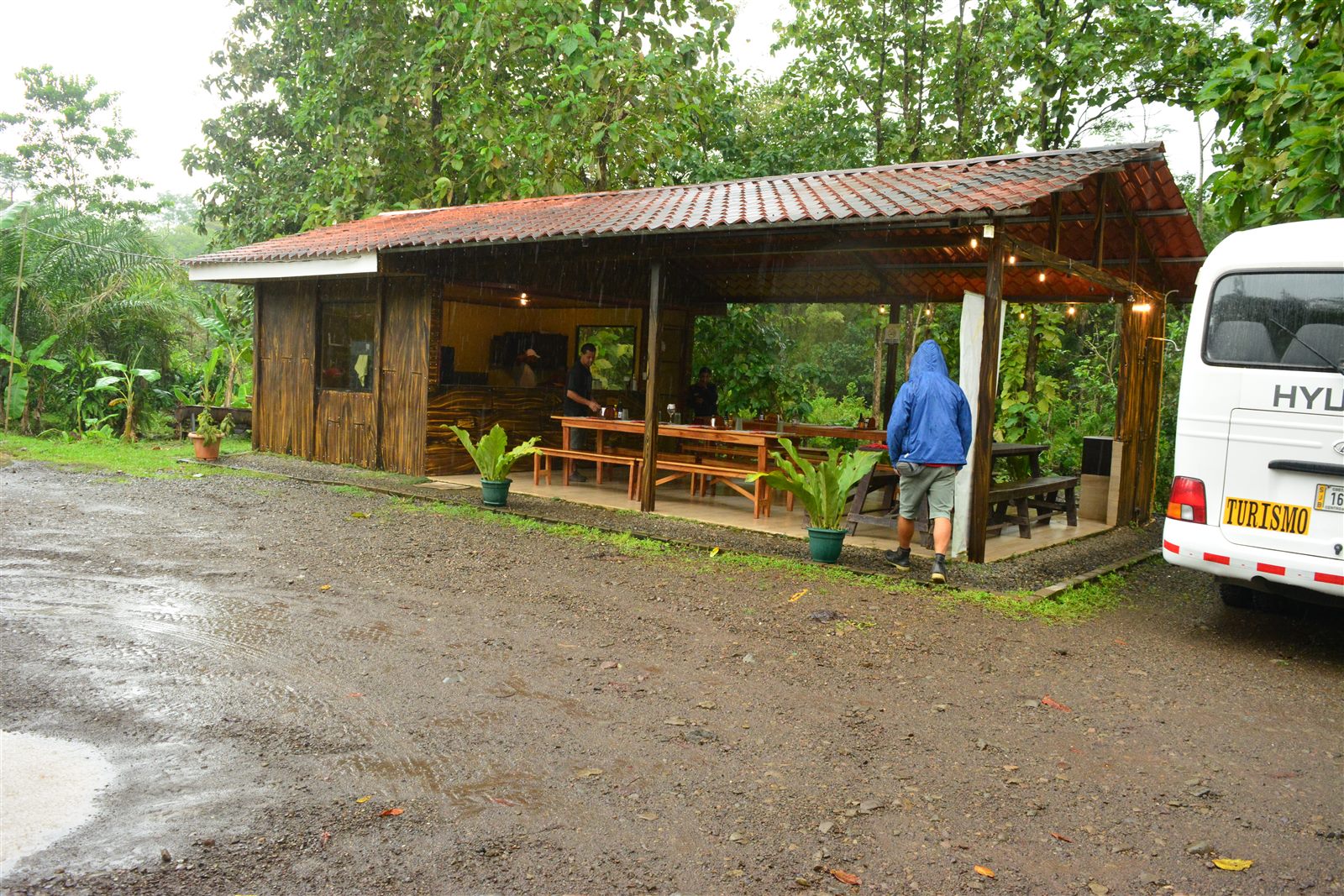 Rainmaker ranch facilities surrounded by tropical forest